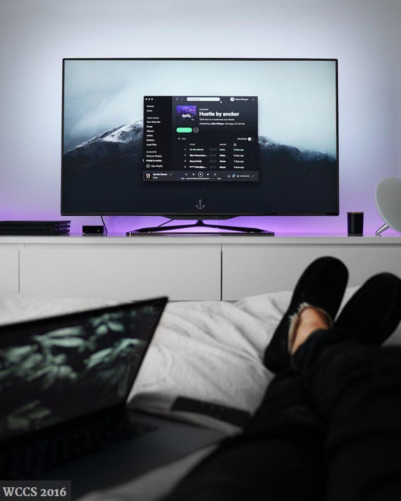 flat screen TV turned on
